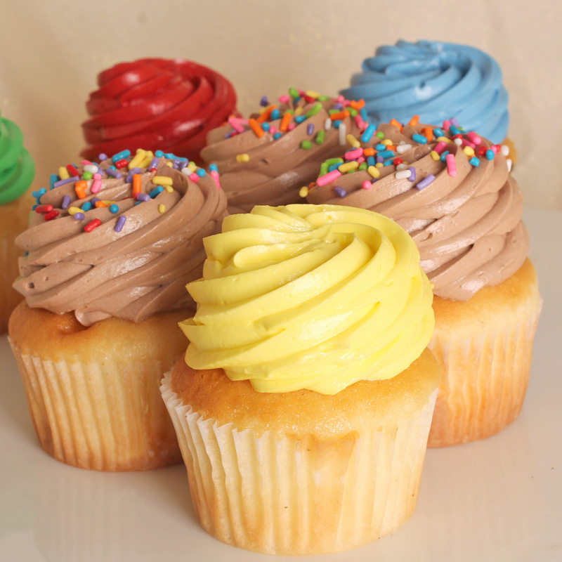 Colorfully Iced Cupcakes and Chocolate Iced Cupcakes With Sprinkles
